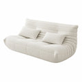 Beżowa sofa trzyosobowa z tkaniny boucle z poduszkami